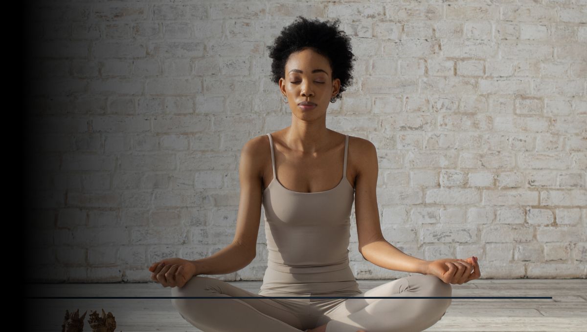 African woman with natural hair and beige clothing at peace